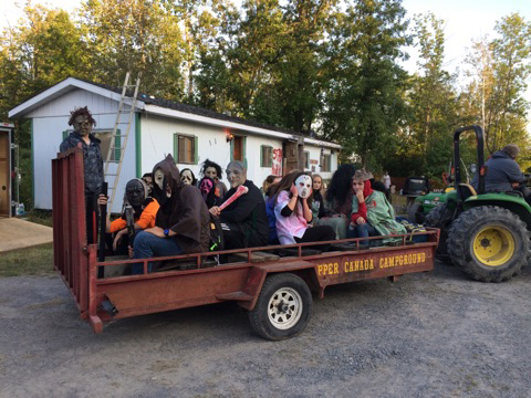 campers on a spooky wagon ride